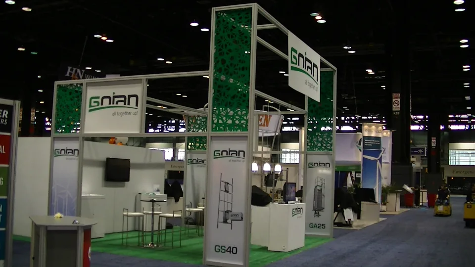 Gnian exhibit with open aluminium frame and green graphic panels