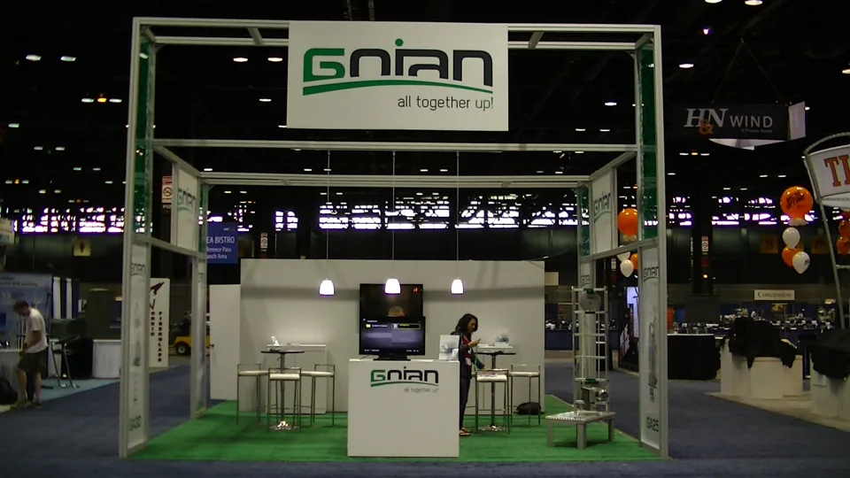 Gnian exhibit with overhead frame and green floor