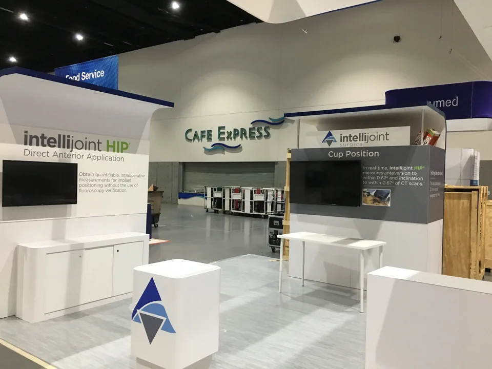 Intellijoint Surgical exhibit with white counters and product graphics