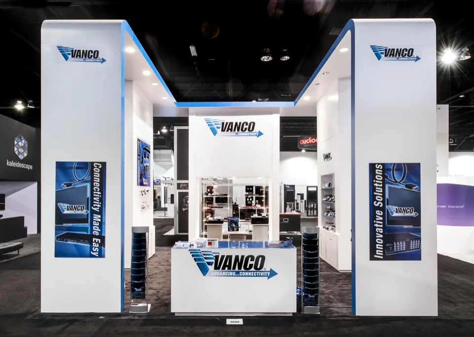 Vanco exhibit with three white towers and a central counter